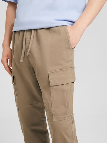 Bershka Tapered Hose in Beige