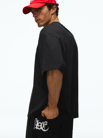 Bershka Wide Leg Bukser med lægfolder i sort