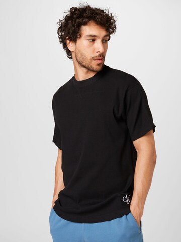 Tricou de la Calvin Klein Jeans pe negru: față