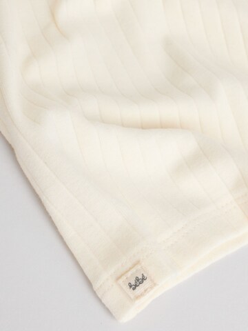 Set de la Next pe bej