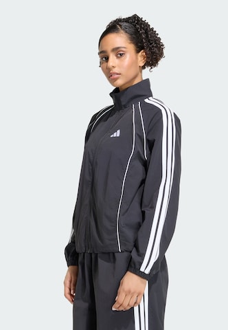 ADIDAS SPORTSWEAR - Casaco de treino 'Iconic' em preto: frente