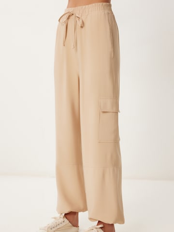 Loosefit Pantalon cargo Happiness İstanbul en beige : devant