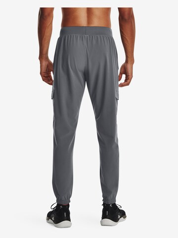 UNDER ARMOUR Tapered Sportbroek in Grijs