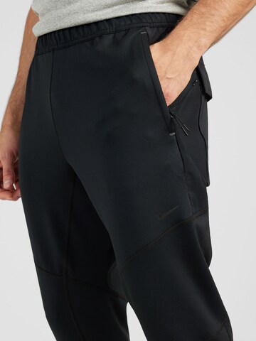 Tapered Pantaloni sport 'DFADV AXIS' de la NIKE pe negru