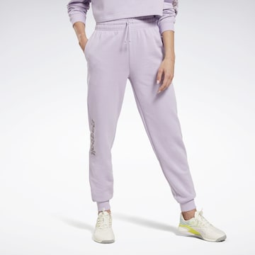 Reebok Tapered Workout Pants in Purple: front