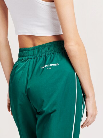 UNFOLLOWED x ABOUT YOU Loose fit Trousers 'ESCAPE PANTS' in Green