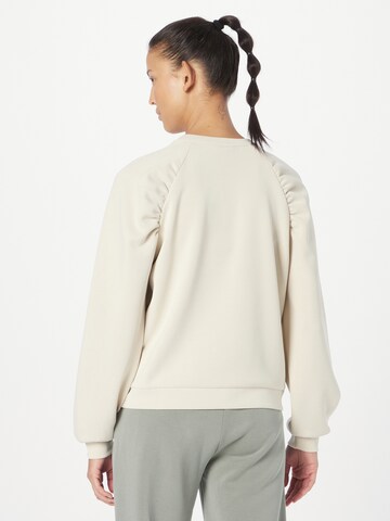 Athlecia Sports sweatshirt in Beige