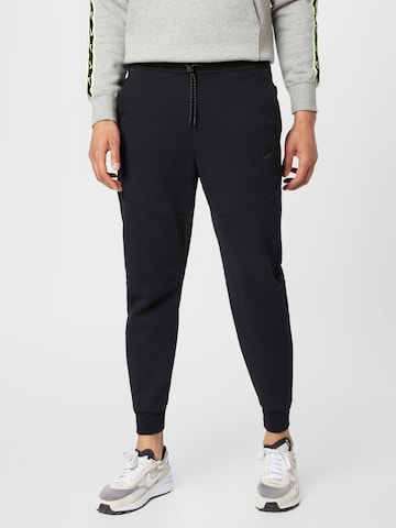 Nike Sportswear Tapered Pants in Black: front