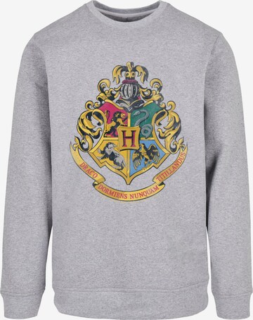 Sweat-shirt 'Harry Potter Distressed Hogwarts Crest' ABSOLUTE CULT en gris : devant