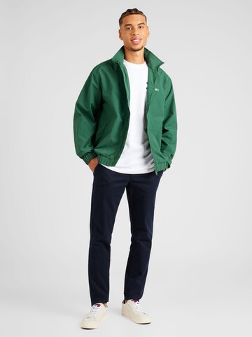Tommy Jeans Overgangsjakke 'ESSENTIAL' i grøn