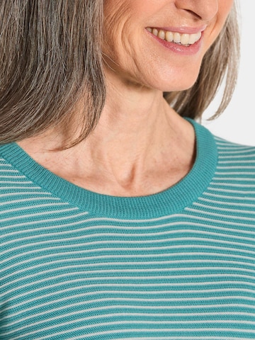 Goldner Pullover in Grün