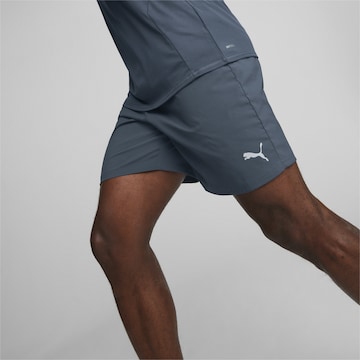 PUMA Regular Workout Pants 'Favourite' in Blue: front