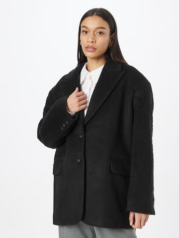 Oval Square - Blazer em preto: frente