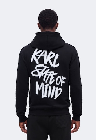 KARL LAGERFELD JEANS Tréning póló 'Karlism' - fekete: elől