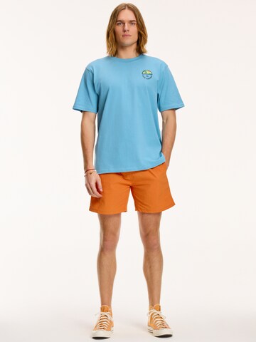 Shiwi Kratke kopalne hlače 'NICK' | oranžna barva