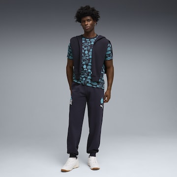 PUMA Tapered Sports trousers in Blue