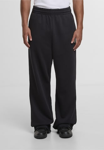 Karl Kani - Loosefit Pantalón '89' en negro: frente
