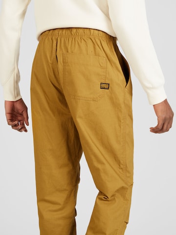 G-Star RAW Zwężany krój Spodnie w kolorze brązowy