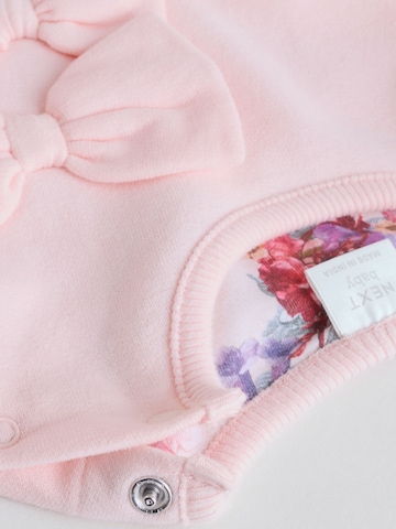 Set Next en rose