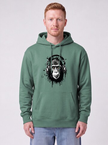 Felpa 'Affe Hört Musik' di Watapparel in verde: frontale