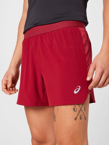 Regular Pantaloni sport 'Road' de la ASICS pe roșu