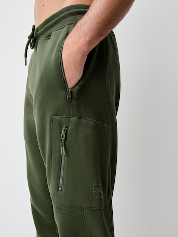 Tapered Pantaloni di Next in verde