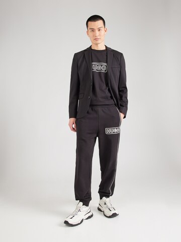 Tapered Pantaloni 'Noiderpant' di HUGO in nero