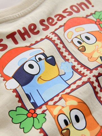 Tricou de la Next pe bej