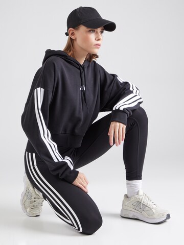 ADIDAS SPORTSWEAR - Camiseta deportiva en negro