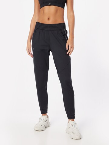 UNDER ARMOUR Tapered Workout Pants 'ColdGear' in Black: front