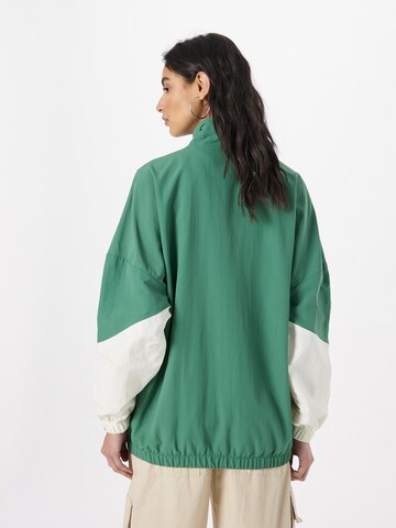 ELLESSE Between-Season Jacket 'Tinst' in Green