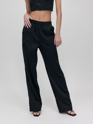 UNFOLLOWED x ABOUT YOU Loose fit Pants 'Bossy' in Black: front