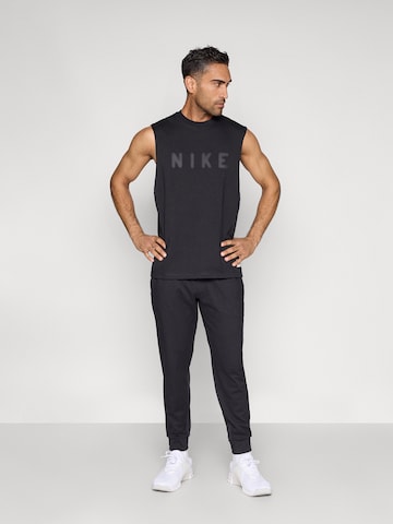 NIKE Tapered Sportsbukser 'PRMRY' i sort
