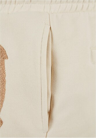 regular Pantaloni di Karl Kani in beige