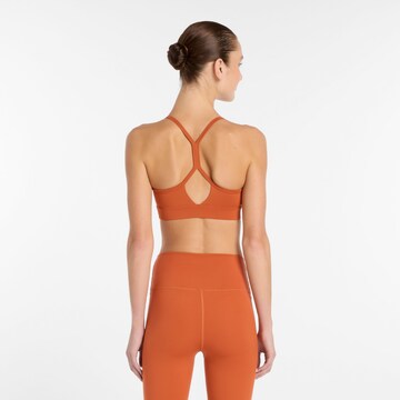 new balance Bralette Sports bra 'Essential' in Orange