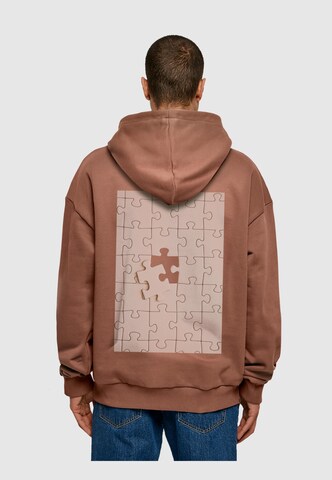 Merchcode Sweatshirt 'Missing Piece' in Braun: predná strana