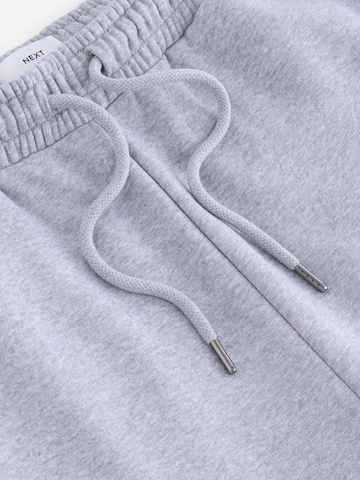Tapered Pantaloni di Next in grigio