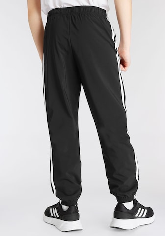 ADIDAS SPORTSWEAR Tapered Urheiluhousut 'Essentials 3-Stripes ' värissä musta