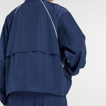 new balance Sports jacket 'Sport Legacy Jacket' in Blue