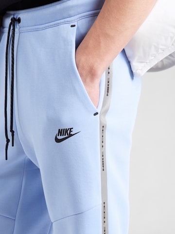 Tapered Pantaloni di Nike Sportswear in blu