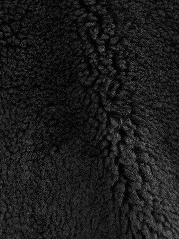 Next - Chaleco en negro