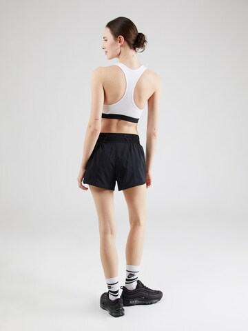Largi Pantaloni sport 'ONE' de la NIKE pe negru