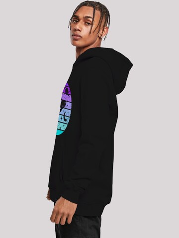 Sweat-shirt 'Retro Alien Weltraum Sonnenuntergang' F4NT4STIC en noir