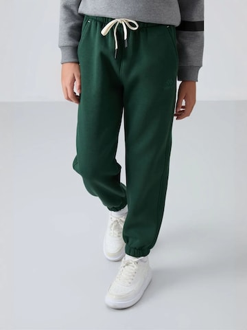 Tommy Life Broek 'TOMMY Kinder Jogginghose' in Groen