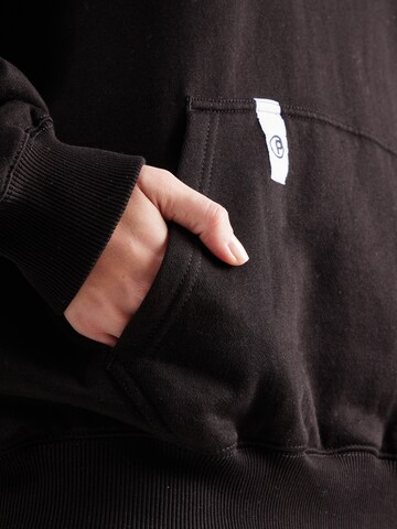 Veste de survêtement 'Lina' Pegador en noir