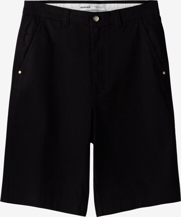 Bershka Loose fit Chino trousers in Black: front