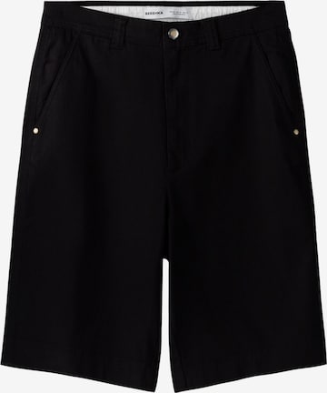 Bershka Loose fit Chino trousers in Black: front