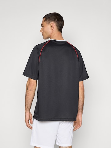 PUMA Performance shirt 'Essentials' in Black