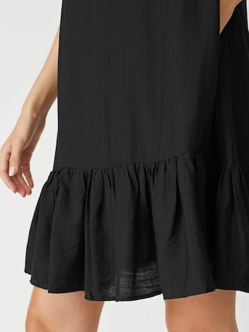 Robe 'Hera' co'couture en noir