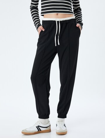Koton Loose fit Trousers in Black: front